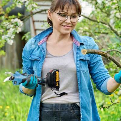 Cordless Chainsaws Pruning Shears Combo Deal with a woman holding a teal and black cordless pruning tool beside a branch