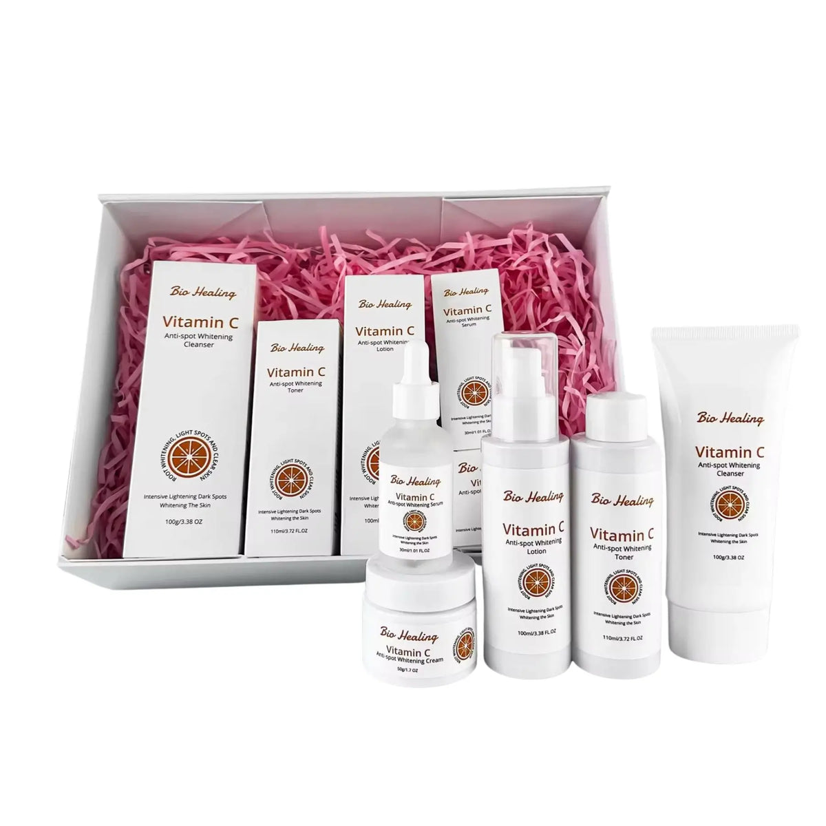 VC Dark Spot Whitening Set, five-piece Vitamin C skincare collection with white bottles and tubes, orange accents and pink filler.